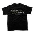 Black t-shirt with white text reading ’DANCING IS DANGEROUS’.