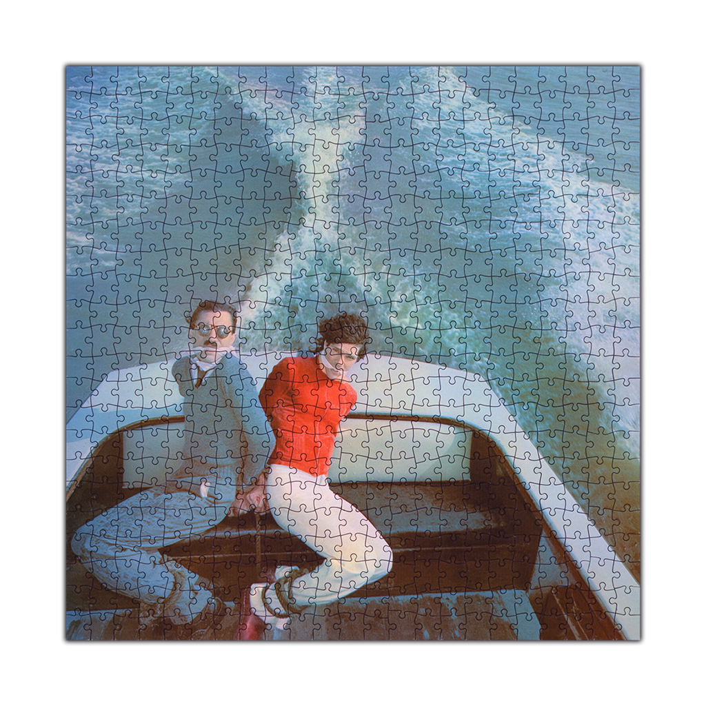 Jigsaw puzzle depicting two people sitting in a boat.