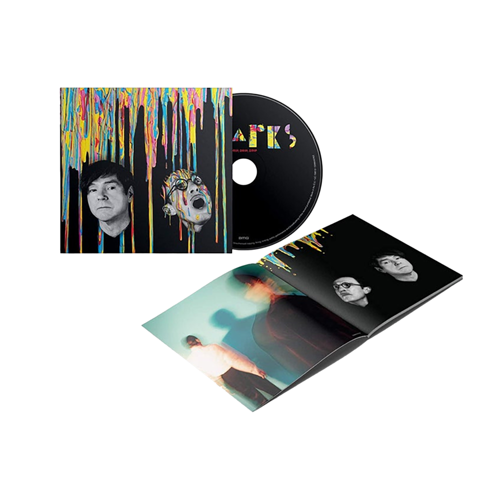 Music album package featuring a CD, jewel case, and album artwork with colorful dripping paint design.
